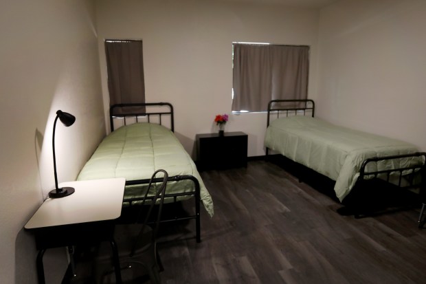 A room at Santa Clara County's new 28-bed inpatient mental health facility is toured, Tuesday, Aug. 8, 2023, in San Jose, Calif. Operated by Momentum for Health, the facility is in a former detox center next to the Santa Clara Valley Medical Center. (Karl Mondon/Bay Area News Group)