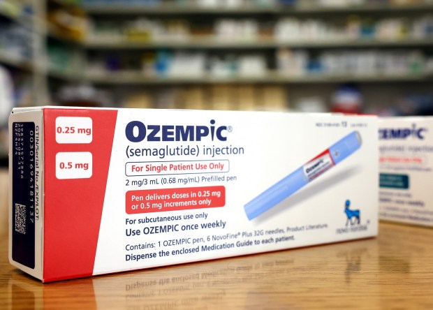 In this photo illustration, boxes of the diabetes drug Ozempic rest on a pharmacy counter on April 17, 2023 in Los Angeles, California. Ozempic was originally approved by the FDA to treat people with type 2 diabetes who risk serious health consequences without medication. In recent months, there has been a spike in demand for Ozempic, or semaglutide, due to its weight loss benefits, which has led to shortages. Some doctors prescribe Ozempic off-label to treat obesity. (Photo illustration by Mario Tama/Getty Images)